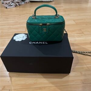 Chanel vanity bag with handle and chain. Excellent condition like new